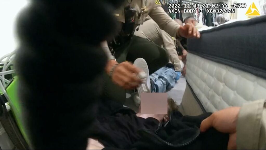 Image taken from body-worn camera footage of the rescue, showing deputies Duran, Cuevas, and Lopez administering Narcan to the two teenage boys. 