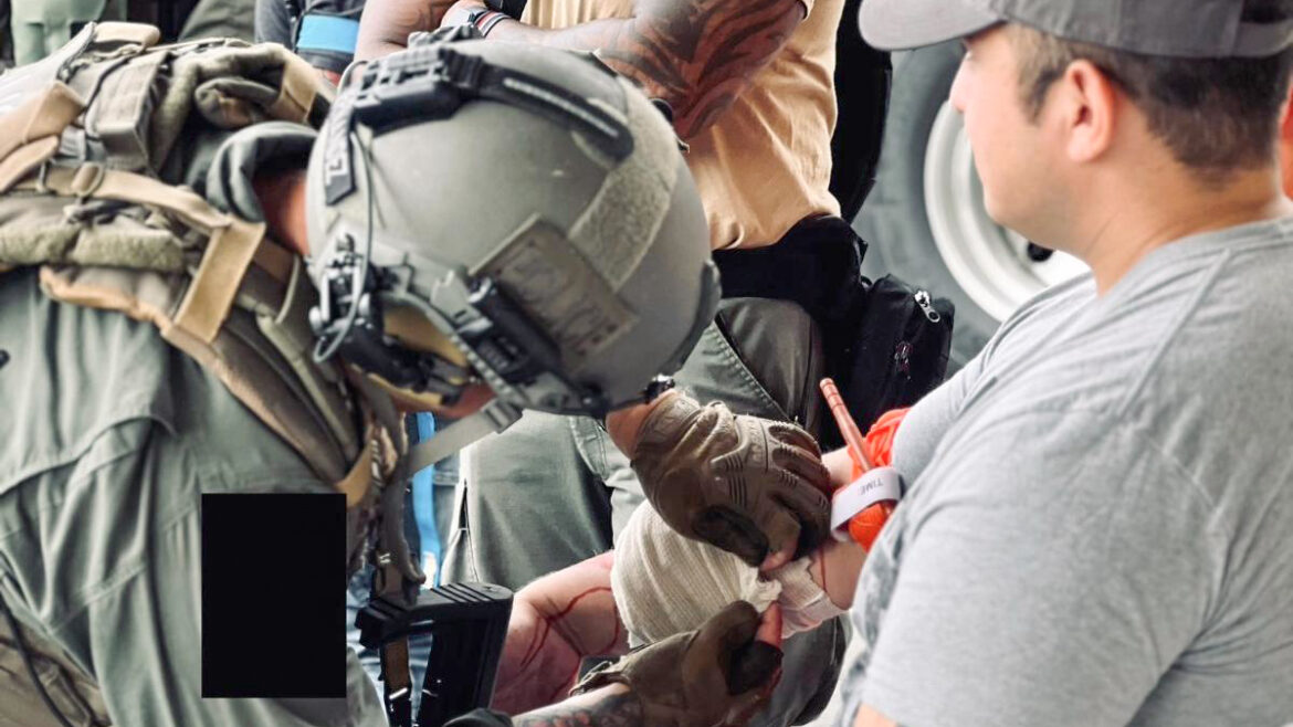 Image of Helicopter Medic placing a bandage on a person.