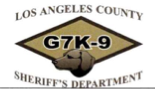 Diamond shaped logo with G 7 K-9 in large letter in center of green diamond. Illustration of a dog's head is at the bottom point of the diamond. Over the top and bottom of the diamond reads: Los Angeles County, under is, Sheriff's Department.